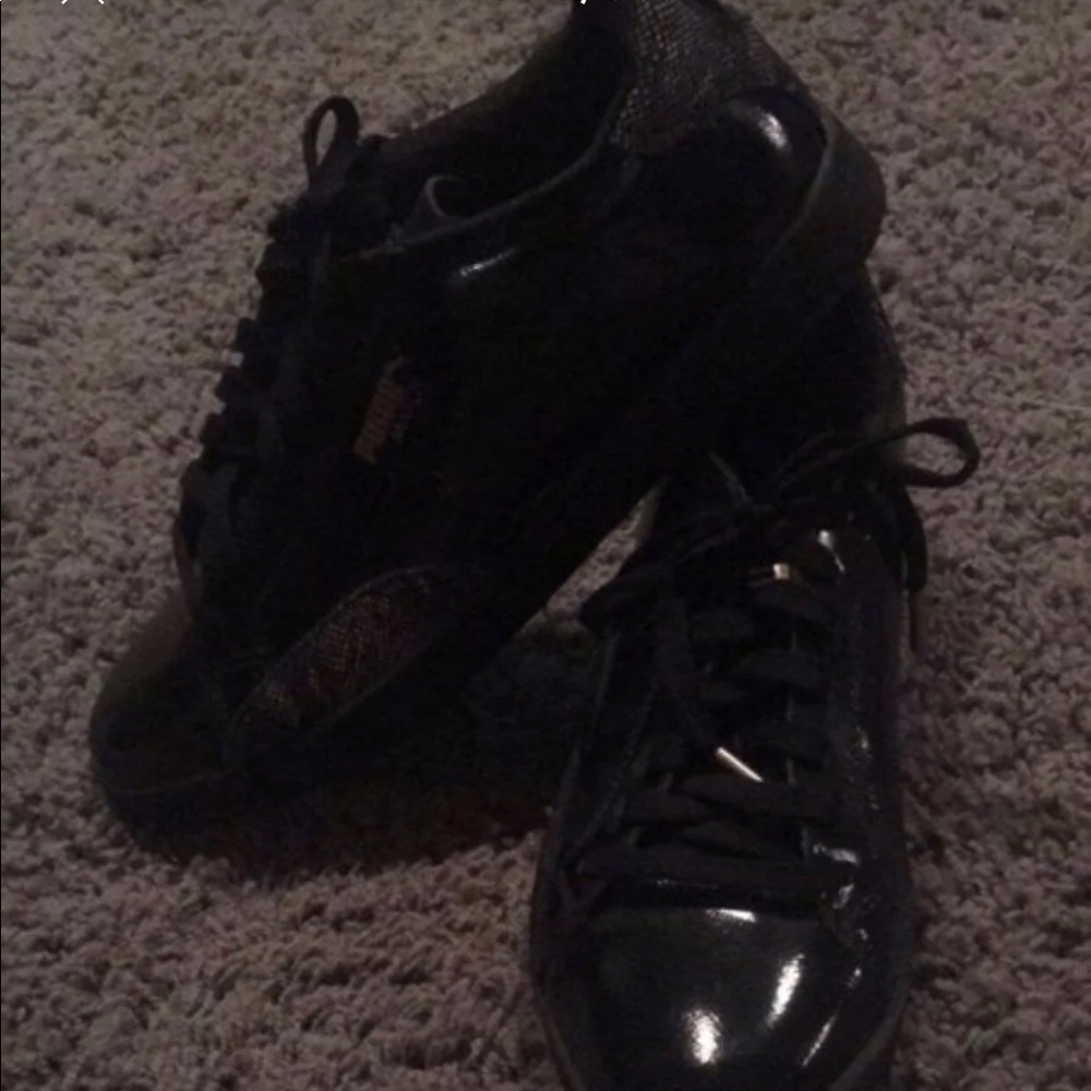 Puma black with snake skin accents shoes.